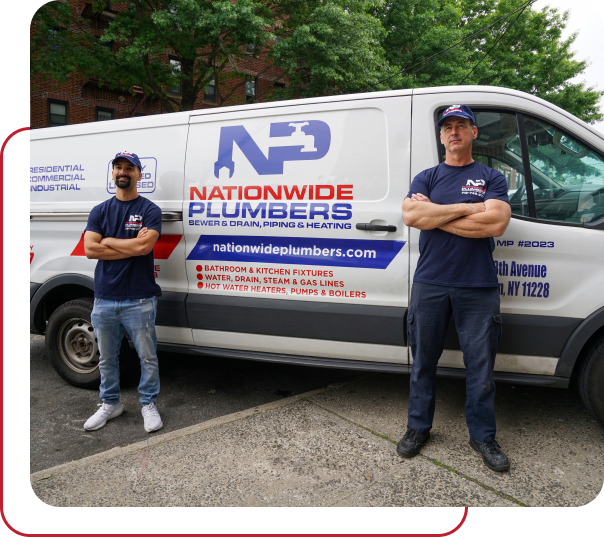 Two Nationwide Plumbers technicians standing with company merch in front of company van